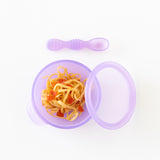 Bumkins Silicone First Feeding Set: Purple Jelly filled with pasta and veggies on a white background.