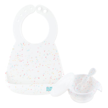 Bumkins Silicone Feeding 4-Piece Set: Vanilla Sprinkle includes a white silicone bib, white bowl, white spoon, and transparent lid.