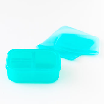 A blue Silicone Lunchtime 4-Piece Set by Bumkins, with lid, similar to our Bento Boxes, sits on a white background.