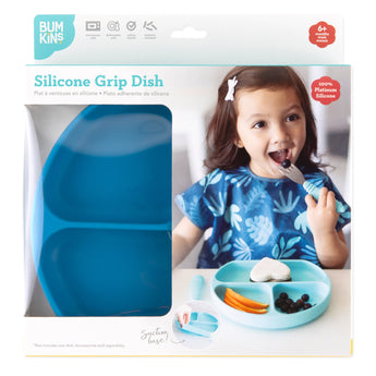 The Bumkins Silicone Grip Dish packaging shows a girl enjoying her meal with perfect toddler portions on a dark blue plate.