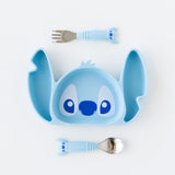 Bumkins Spoon + Fork: Stitch sits by a Stitch-shaped silicone plate on a white background.
