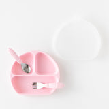A plate, lid, and toddler utensils from Bumkins On-The-Go Mealtime 6-Piece Set: Boots + Pink rest on a white background.