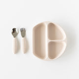 A dish and utensils from Bumkins On-The-Go Mealtime 6-Piece Set: Wander + Sand are neatly arranged on a white background.