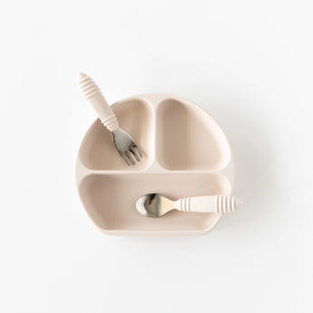 A plate and utensils from Bumkins On-The-Go Mealtime 6-Piece Set: Wander + Sand rest on a white background.