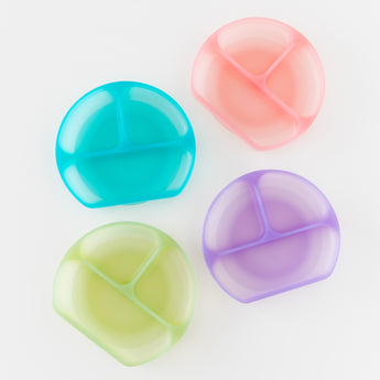 Four dishes, including Bumkins Silicone Grip Dish: Purple Jelly, are arranged on a white background.