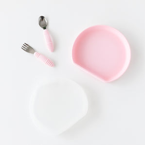 Bumkins Grip Plate Essential 4-Piece Mealtime Set in pink arranged on a white background.
