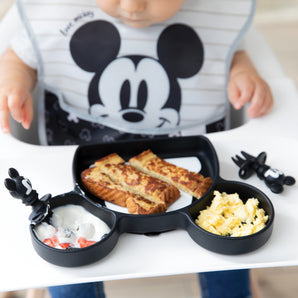 A baby enjoys grilled cheese, eggs, and yogurt with fruit using the Growing with Bumkins Gift Set, Disney Mickey Mouse by Bumkins.