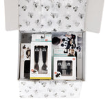 Open box with Bumkins Growing with Bumkins Gift Set, Disney Mickey Mouse, featuring Mickey designs on printed tissue paper.