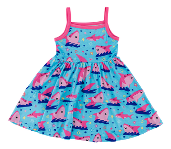 The Gwen Birdie Dress by Birdie Bean is comfy and lightweight, featuring blue with pink straps and rocket ships on a starry background.