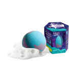 A round blue/purple bath bomb with bubbles, next to its plant-based Galaxy Bath Bombs packaging by Loot Toys.