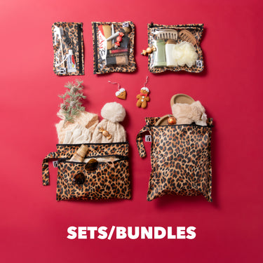 Four leopard-print bags filled with various holiday items against a red background, labeled SETS/BUNDLES at the bottom.