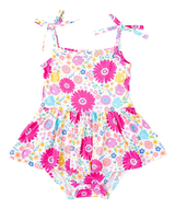 Jasmin Birdie Twirl by Birdie Bean: A bamboo viscose floral baby romper with pink/yellow flowers, spaghetti straps, and skirted bottom.