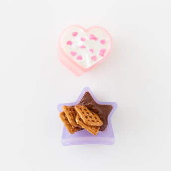 Bumkins Silicone Little Dipper Combo 2 Pack: Magenta Jelly on a white background: heart cup with yogurt, and star cup with chocolate & pretzels