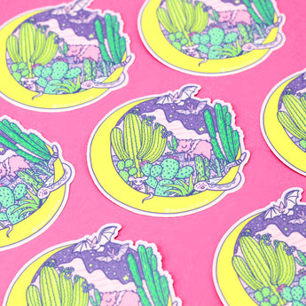 Turtle Soups Desert Moon Vinyl Sticker features pastel cacti, a crescent moon, and a lizard on pink; its scratch-resistant and neatly patterned.