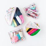 Bumkins The Outfit Organizer Essential 5-Piece Set: Boots holds clothes, makeup, and toiletries on a white background.