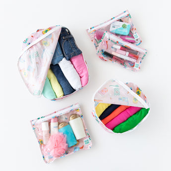 Bumkins The Outfit Organizer Essential 5-Piece Set: Boots holds clothes, makeup, and toiletries on a white background.