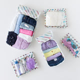 Bumkins The Outfit Organizer Essential 5-Piece Set: Mickey & Friends Varsity holds clothes, sunglasses, & toiletries on a white background.