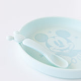 Close-up of Bumkins Silicone Plate + Spoon Set: Disney Mickey Mouse on a white background.