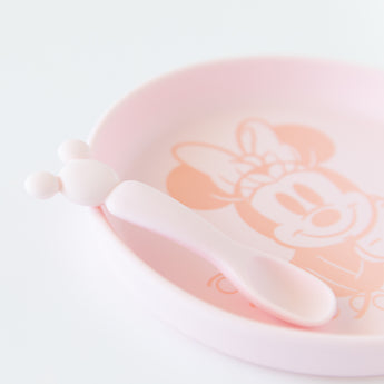 Close-up of Bumkins Silicone Plate + Spoon Set: Disney Minnie Mouse on a white background.