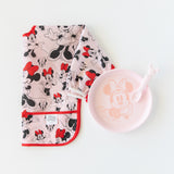 Bumkins Silicone Plate + Spoon Set: Disney Minnie Mouse sits next to a bib featuring Minnie Mouse illustrations on a white background.