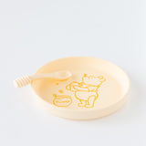 Bumkins Silicone Plate + Spoon Set: Disney Winnie the Pooh rests on a white background.