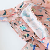 Close-up of Bumkins Packable Tote Bag: Yoga Pals on a white background, with focus on the interior pocket.