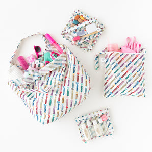 Bumkins The Playdate Planner Deluxe 5-Piece Set: Mickey & Friends Varsity holds swim gear, toys, and toiletries on a white background.