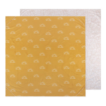 Bumkins Reversible Roll & Go Blanket, Desert Boho features a beige & white abstract design on one side, and a yellow sun print on the other.