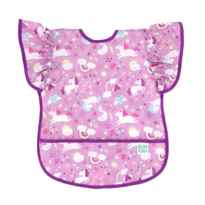 Bumkins Ruffle Apron Bib: Unicorns features purple waterproof fabric with a unicorn pattern, ruffle sleeves, purple trim, and front pocket.