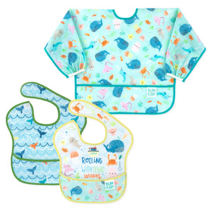 Three Bumkins SuperBibs—Rolling With The Waves, Whale Tail, and Ocean Life—are displayed on a white background.