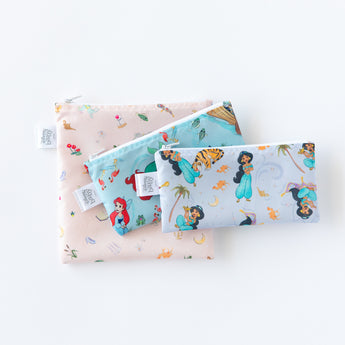 Bags from Bumkins Snack In Character 4-Piece Set: Disney Princess Magic Cinderella lay stacked on a white background.