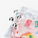 Close-up of Roamio by Bumkins Snack Bag 4 Pack: Disco Boots stacked on a white background, with focus on the zippers and logo tags.