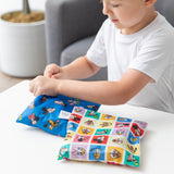 A child holds a Bumkins Snack Bag 4 Pack: Mickey & Friends Excellent Eight at a white table.