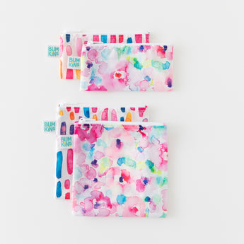 Four Bumkins Reusable Snack Bags in Watercolor & Brushstrokes patterns, sold as a 4 pack, shown on a white background.