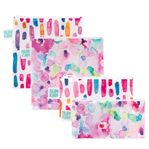 Four Bumkins Reusable Snack Bags in Watercolor and Brushstrokes patterns, shown in two overlapping pairs.