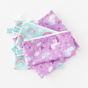 Bumkins Reusable Snack Bag 4 Pack: Unicorns and Rainbows lays stacked on a white background.