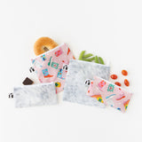 Bags from Bumkins Lunchbox Legends 6-Piece Set: Disco Pink Jelly hold snacks on a white background.