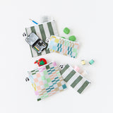 Roamio by Bumkins Snack Bag 4 Pack: Motley Club is messily arranged on a white background with sewing supplies peeking out.