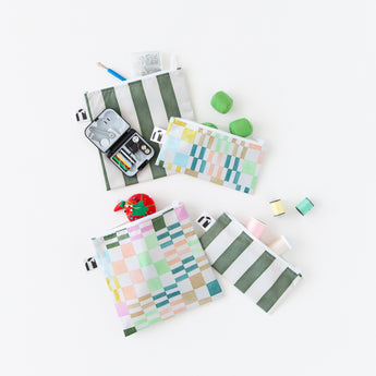 Roamio by Bumkins Snack Bag 4 Pack: Motley Club is messily arranged on a white background with sewing supplies peeking out.