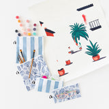 Roamio by Bumkins Snack Bag 4 Pack: Coastal lays fanned out on a white background with paints & brushes peeking out next to a painting.