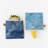 Roamio by Bumkins Reusable Snack Bag, Large 2 Pack: Denim on Denim holds a sandwich and a banana on a white background.