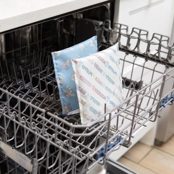 Bumkins Reusable Snack Bag, Large 2 Pack: Mickey & Friends MVP sits in the top rack of a dishwasher.