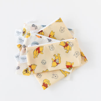 Bumkins Reusable Snack Bag 4 Pack: Disney Pooh Bear + Friends lays stacked on a white background.