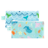 Bumkins Reusable Snack Bag, Small 2-Pack: Ocean Life & Whale Tail includes 2 zippered pouches with ocean designs on blue waterproof fabric.