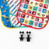 Bumkins Silicone Chewtensils®: Mickey Mouse lay on a white background below three colorful Disney-themed bibs.