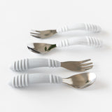 Two Bumkins Spoon + Fork: Gray sets with white textured handles on a white surface; ideal toddler utensils.