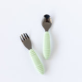 Bumkins Spoon + Fork: Sage rests on a white background.