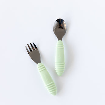 Bumkins Spoon + Fork: Sage rests on a white background.