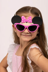 A child beams in her pink dress with Sunstaches Lil Characters Minnie Mouse sunglasses, offering cute Disney style and kids UV protection.