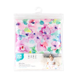 Bumkins Splat Mat: Watercolor is shown folded in plastic packaging bag with a hanger and cardboard insert.